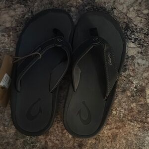 OluKai Dark Flip Flops
